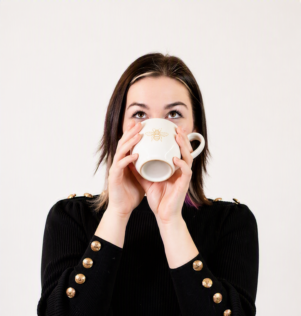 Baylee Willard sipping from a mug